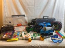 Toy lot: basketball hoop, monster truck, TMNT bank, various trucks, books, etc.