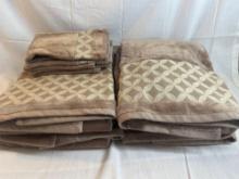 Set of tan bathroom towels with geometric pattern