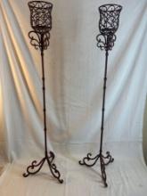 Ornate standing metal candle holders. 42? tall. Set of two.