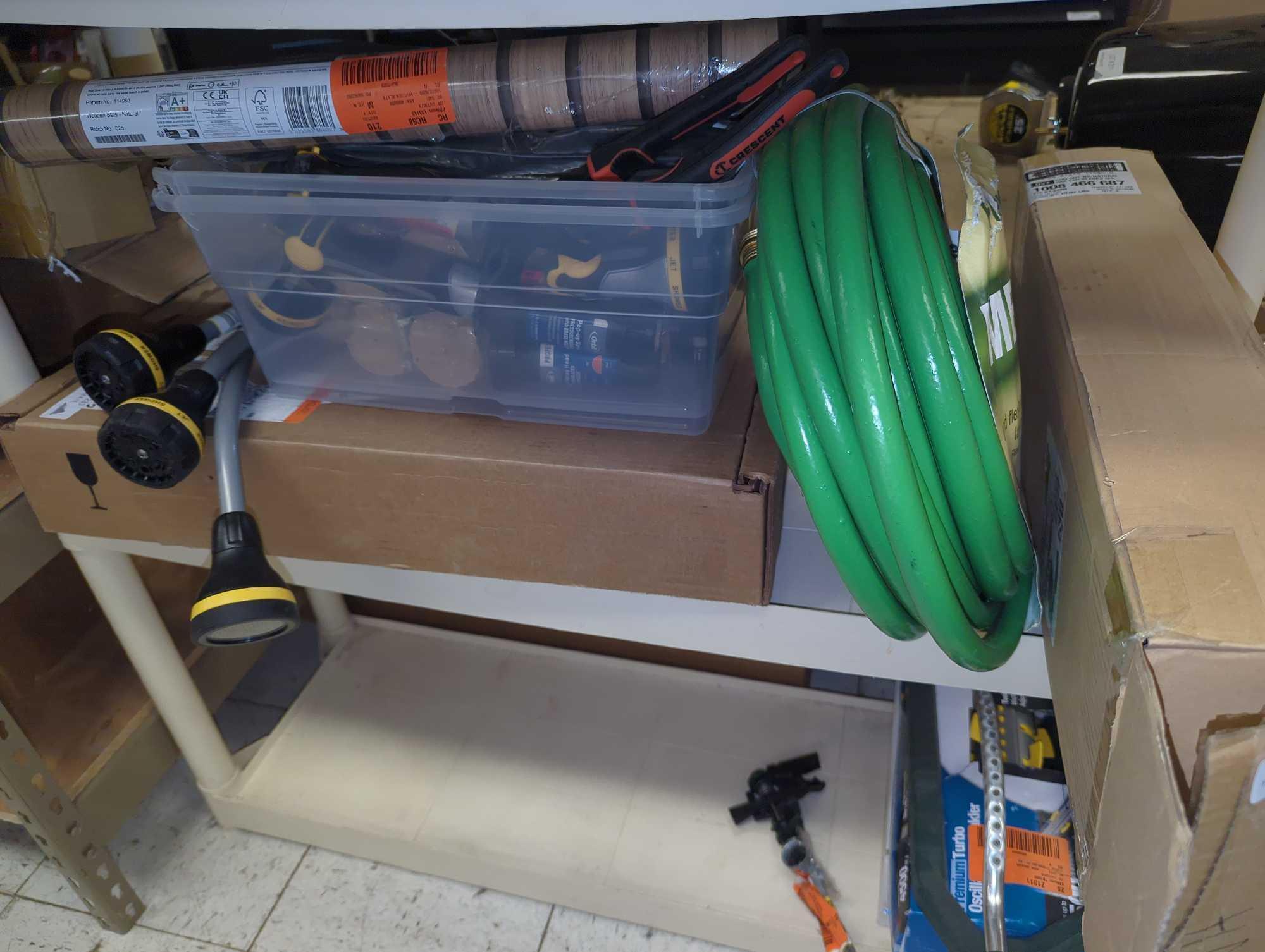 Shelf Lot of Assorted Items Including Toilet Seats, Toilet Tanks, Spray Nozzles, Garden Hoses,