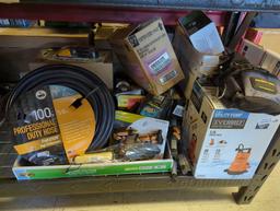 Box lot of assorted items including 100-ft professional duty hose, 2-in-1 utility pump, front