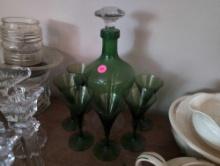 (LR) 7 PC. VINTAGE GREEN GLASS DECANTER AND STEMWARE SET. DECANTER IS 11"T X 5"T.