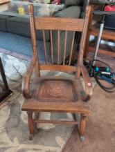 (LR) ANTIQUE OAK SPINDLE BACK CHILD'S ROCKING CHAIR WITH TOOLED LEATHER SEAT, NAIL HEAD TRIM