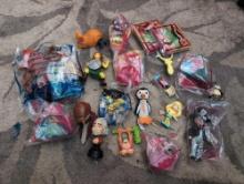 (LR) BAG LOT OF MISC. HAPPY MEAL TOYS.