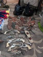 (LR) (3) BAGS FULL OF VINTAGE COWBOY CAP GUN REVOLVERS, HOLSTERS, & SPURS. BRAND NAMES INCLUDE