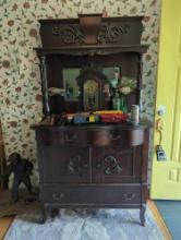 (FD)ANTIQUE OAK STAINED STEP BACK SIDE BOARD. SERPENTINE FRONT, FEATURES 3 DRAWERS, 2 DOORS, AND