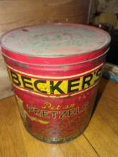 (DR) BECKERS PRETZELS TIN WITH LID, APPROXIMATE DIMENSIONS - 14" H X 12" W, TIN HAS A FEW DENTS,