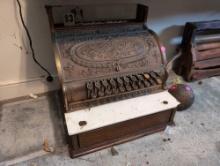 (BR2) ANTIQUE ORNATE BRASS & WOOD CASH REGISTER. WHITE TILE GOING ACROSS THE FRONT (CHIPPED). SEEMS