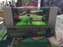 (LR) NIGHTHUNTER MINI HELICOPTER RC TOY, OPEN BOX, UNIT IS STILL TIED TO THE BOX.