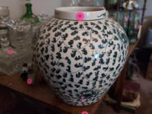 (LR) LARGE ORIENTAL BLUE AND WHITE FLORAL DETAILED PORCELAIN FLOWER VASE. MARKED ON THE BOTTOM.