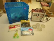 Storage bin of fishing lures, Schauer chargemaster automatic battery charger-10 amp, and glass