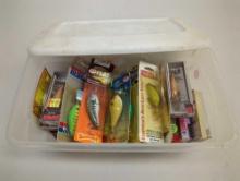 White Sterilite organizer tote filled with packaged fishing lures. Comes as is shown in photos.