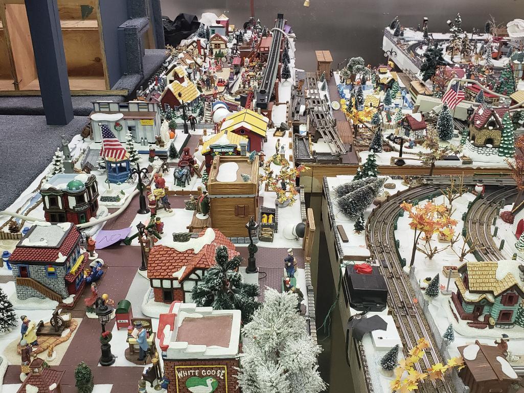O gauge train set with tables and all Christmas village parts as pictured.