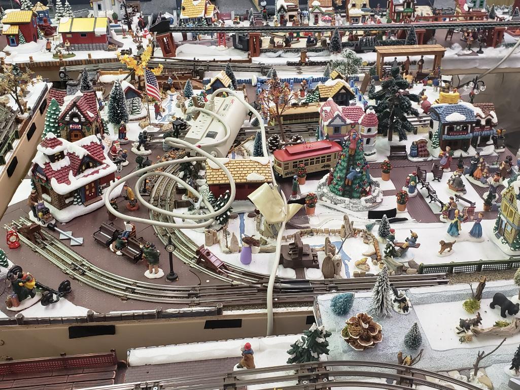 O gauge train set with tables and all Christmas village parts as pictured.