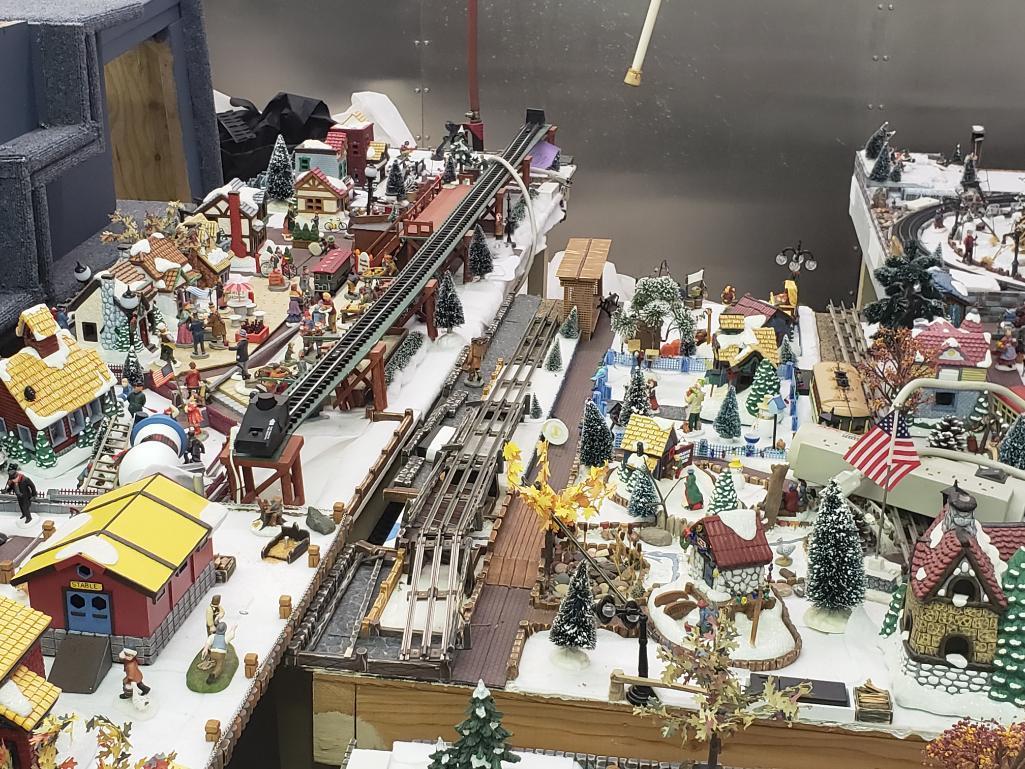 O gauge train set with tables and all Christmas village parts as pictured.