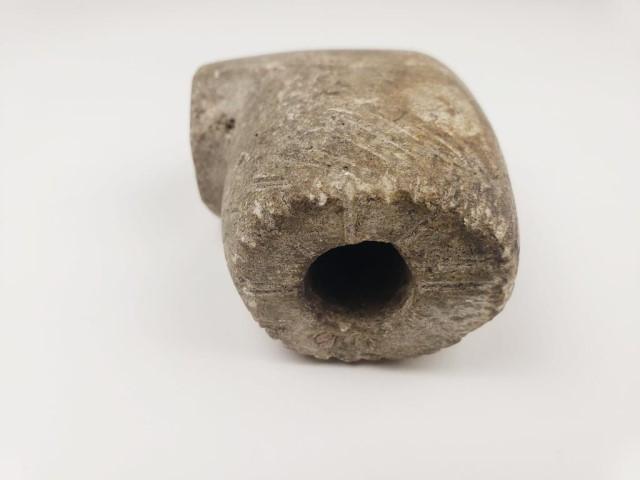 Large prehistoric pipe, steatite, engraved