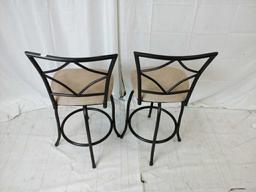 Pair of metal black and tan bar stools.