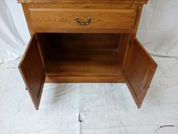 Two-piece oak china hutch with leaded glass doors