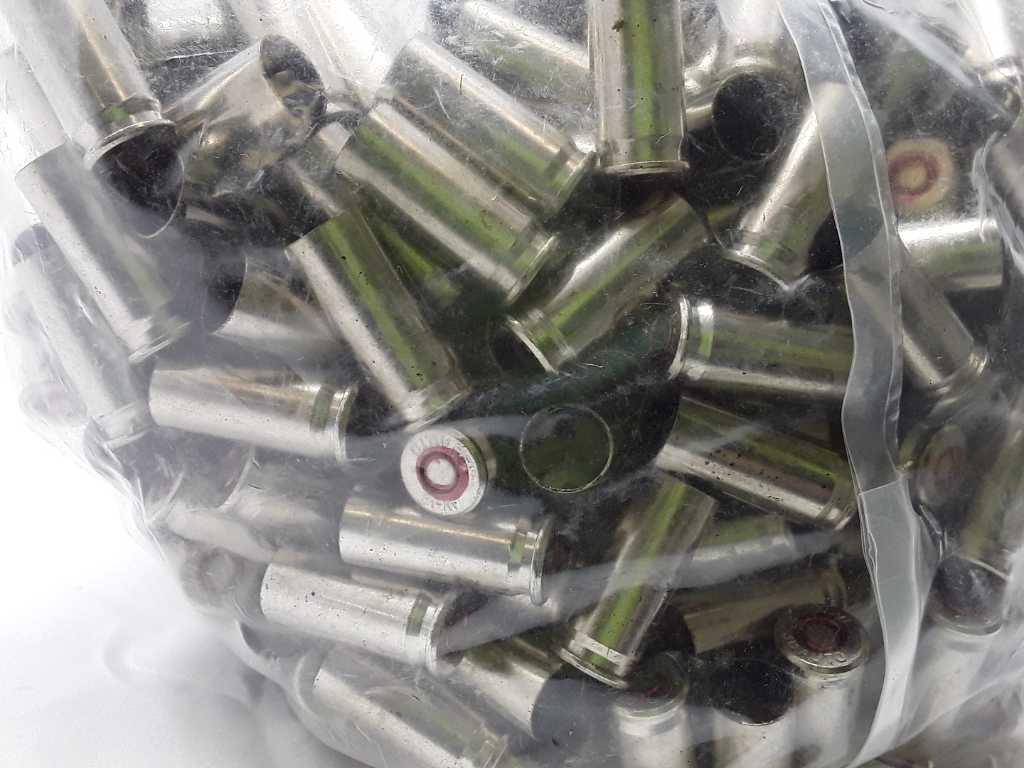 1 Bag of 38 Auto Nickled Casings.