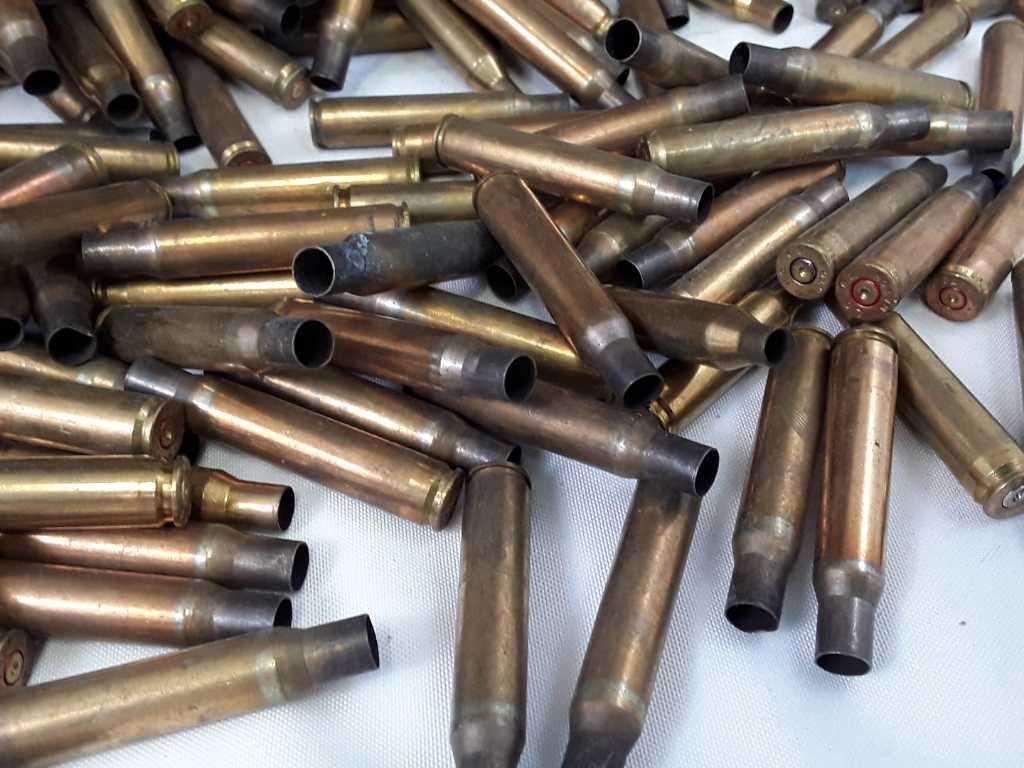 1 LARGE BOX OF PRIMED MISC UNKNOWN CALIBER CASINGS