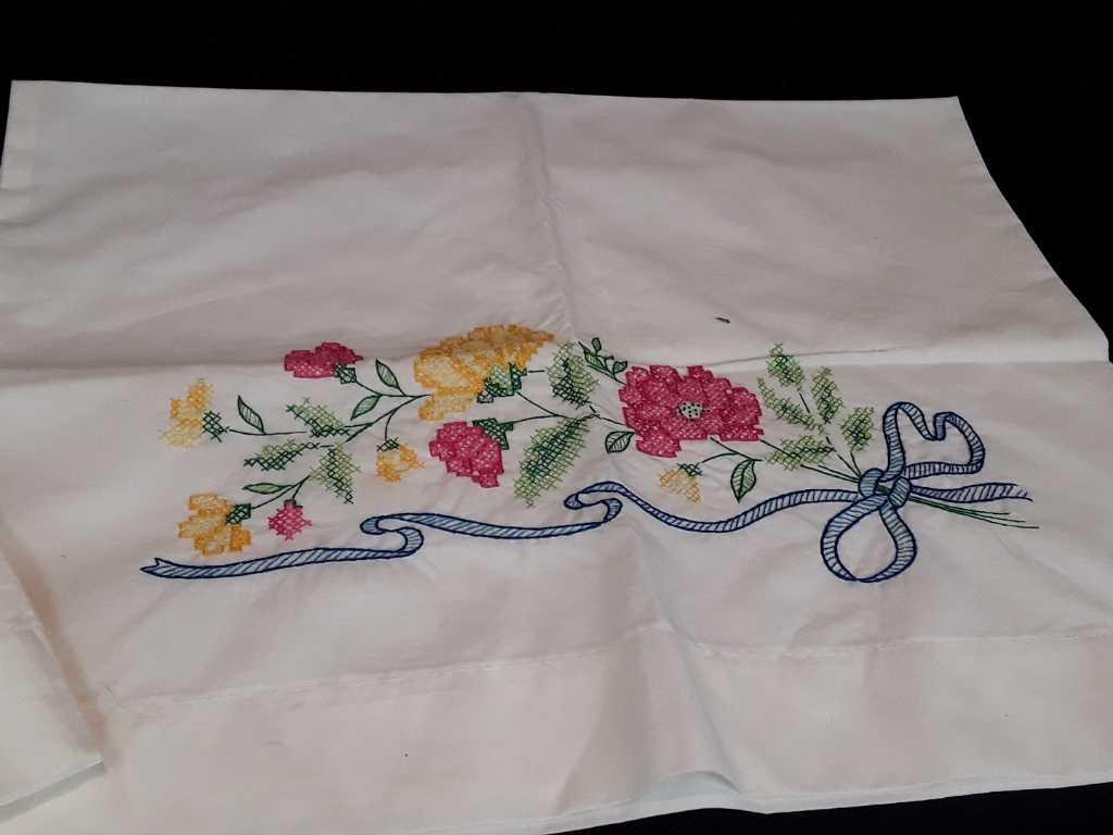 SET OF HAND EMBROIDERED PILLOWCASES W/BLUE RIBBON