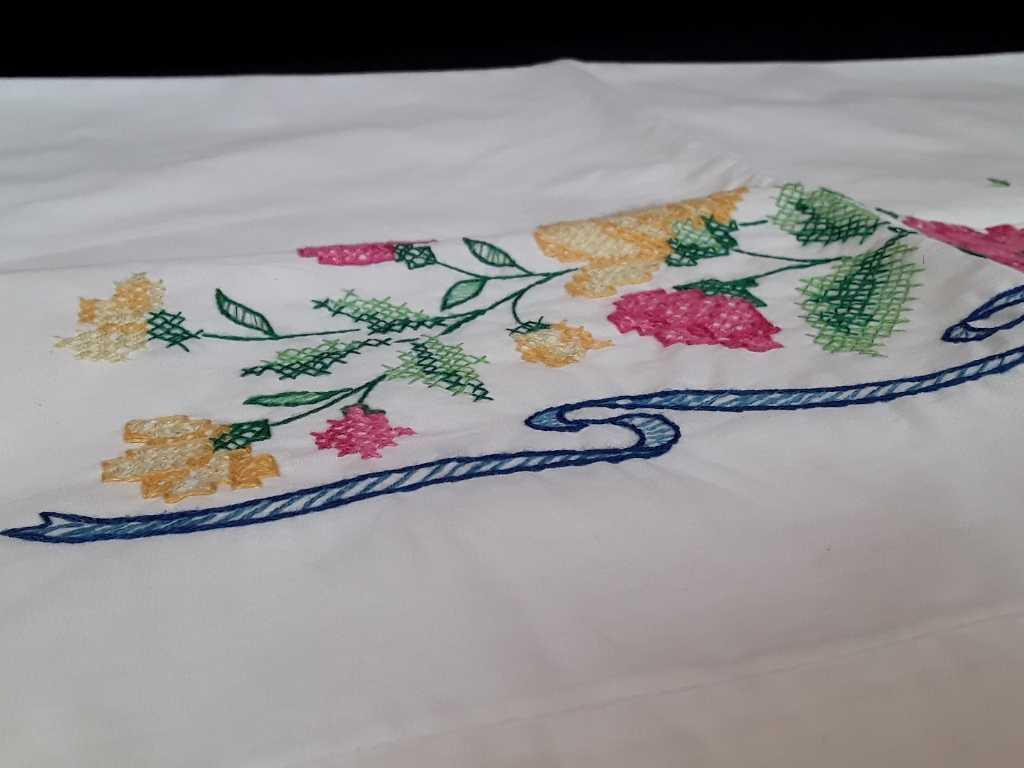 SET OF HAND EMBROIDERED PILLOWCASES W/BLUE RIBBON