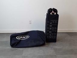 GRACO FOLDING PLAYPEN. NAVY COLOR