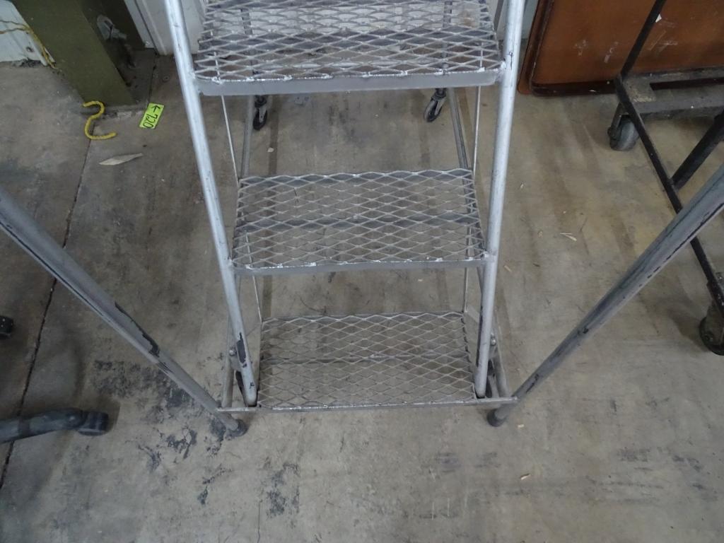 METAL FRAMED STEP LADDER ON WHEELS