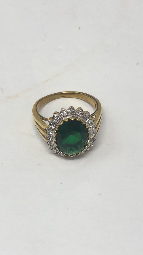 GOLD TONE OVAL CUT GREEN STONE RING