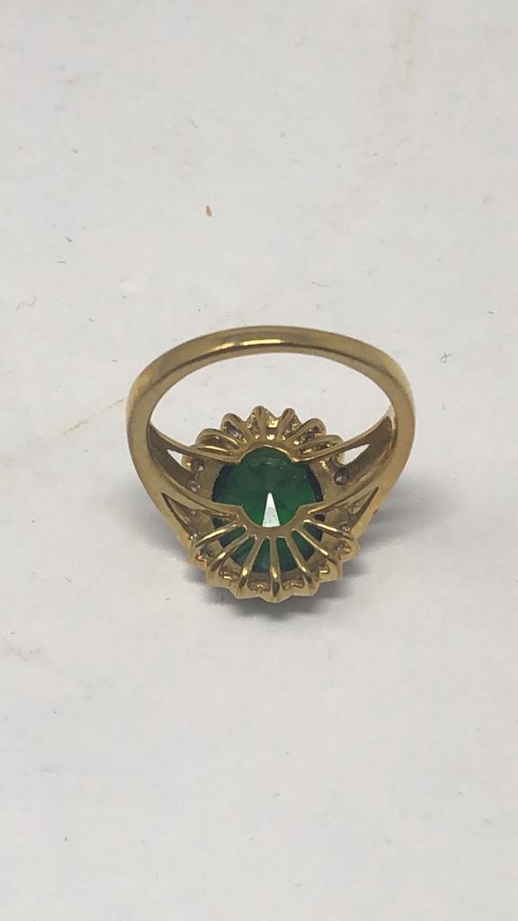 GOLD TONE OVAL CUT GREEN STONE RING