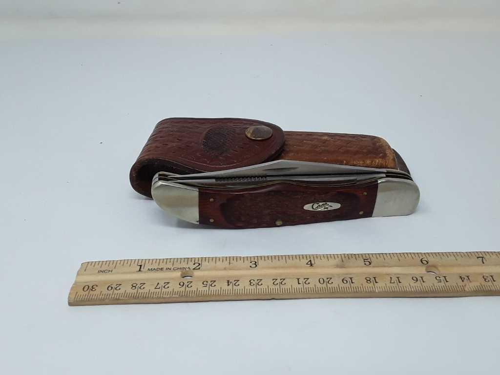 CASE FOLDING KNIFE WITH LEATHER BELT POUCH.