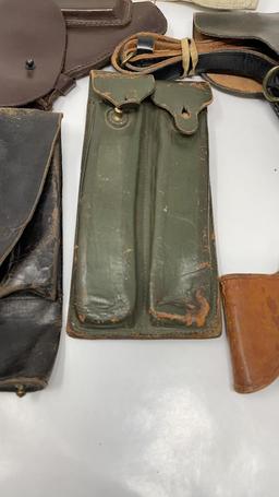 5) LEATHER HOLSTERS & 1) LEATHER MAGAZINE HOLDER.