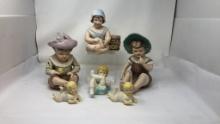 BISQUE PORCELAIN PIANO BABY FIGURINES