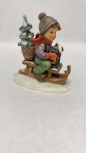 M.I. HUMMEL FIGURINE "RIDE INTO CHRISTMAS"