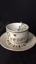 "PRESENT" BLACK/GOLD-TONE MUSTACHE TEACUP & SAUCER