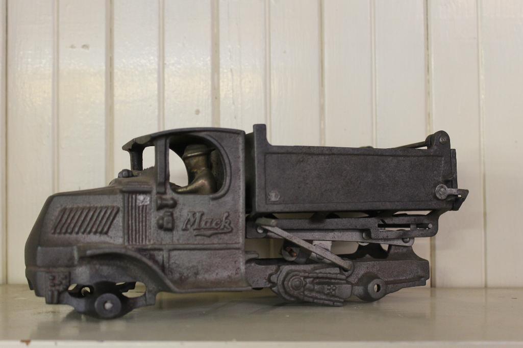 Cast Iron Mack Dump Truck Toy Arcade Mfg USA, No Wheels, Includes Driver 12in x 5in