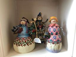 Three Shelves of Jim Shore Christmas Collectibles