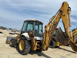 NEW HOLLAND 555E TRACTOR LOADER BACKHOE SN:31002410 powered by diesel engine, equipped with OROPS,