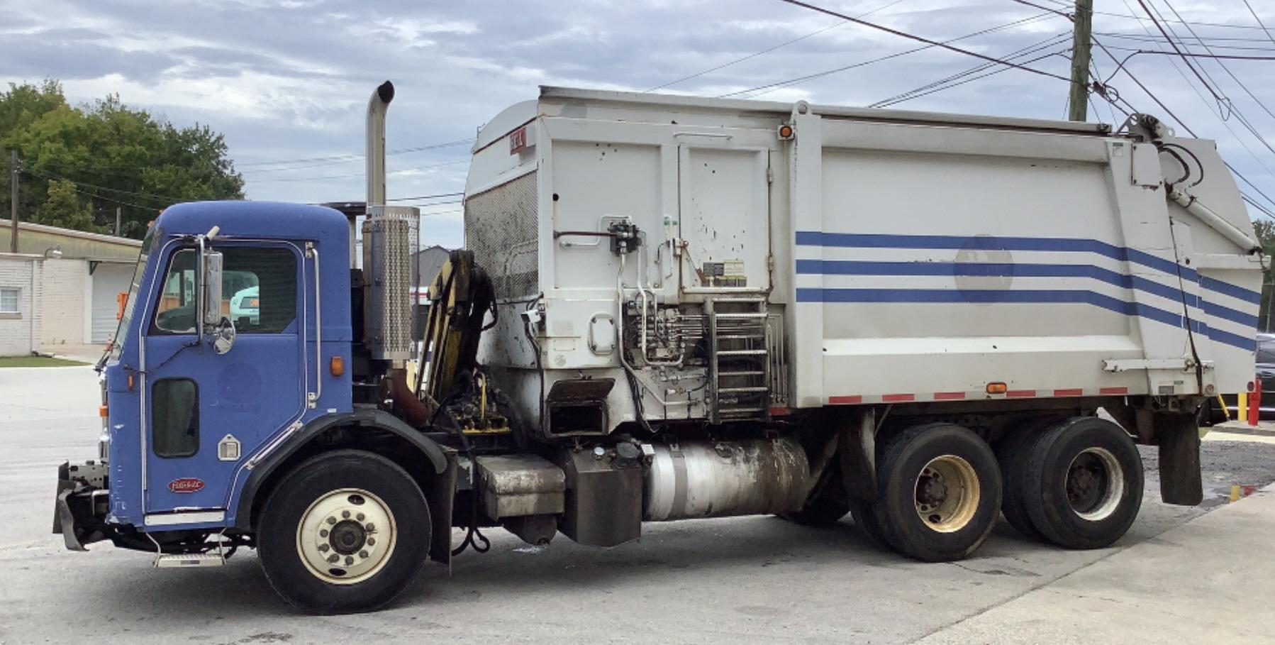 2007 Peterbilt 320 Side Load Garbage Truck 10% BP