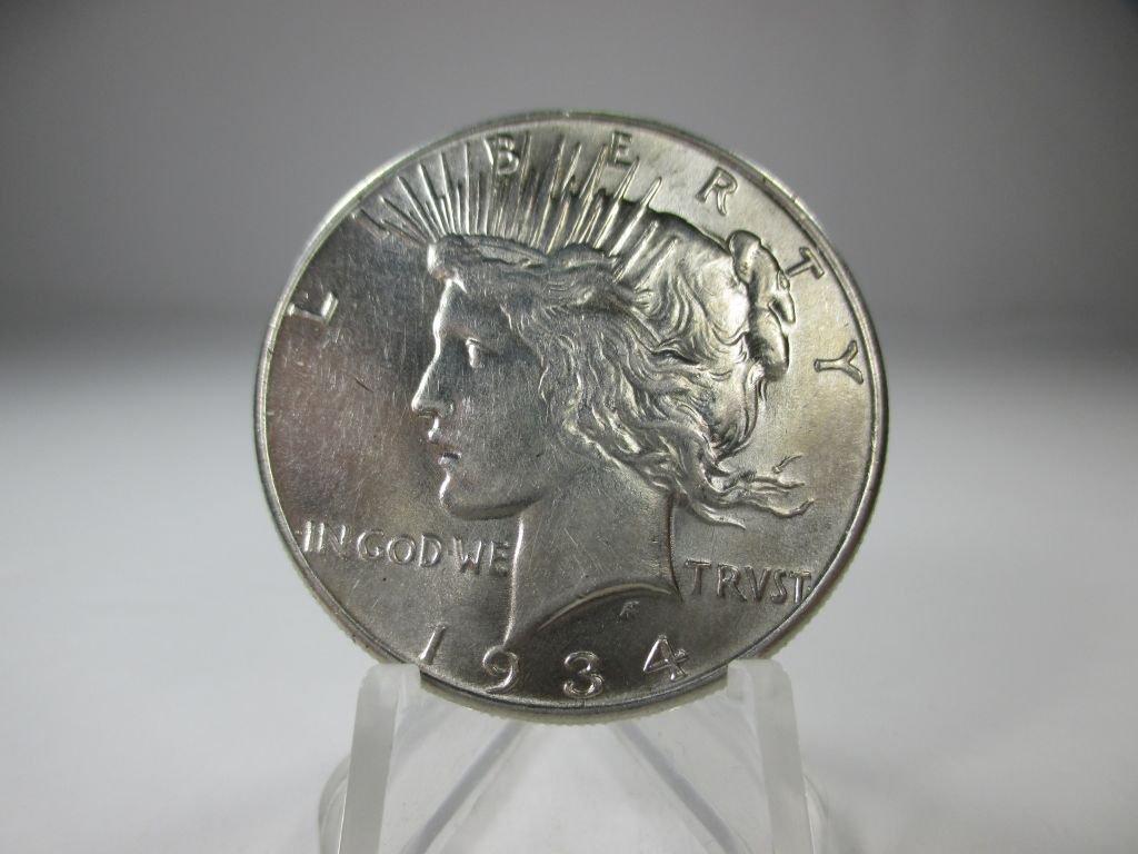 jr-26 Gem BU 1934-P Peace Silver Dollar. Full mint luster and strong details on this RARE coin.