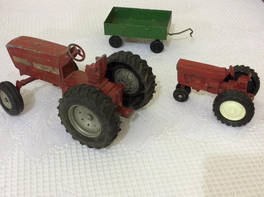 Box Including 2 Ertl Tractors,