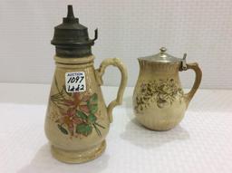 Lot of 2 Floral Painted Iron Stone Syrup PItchers