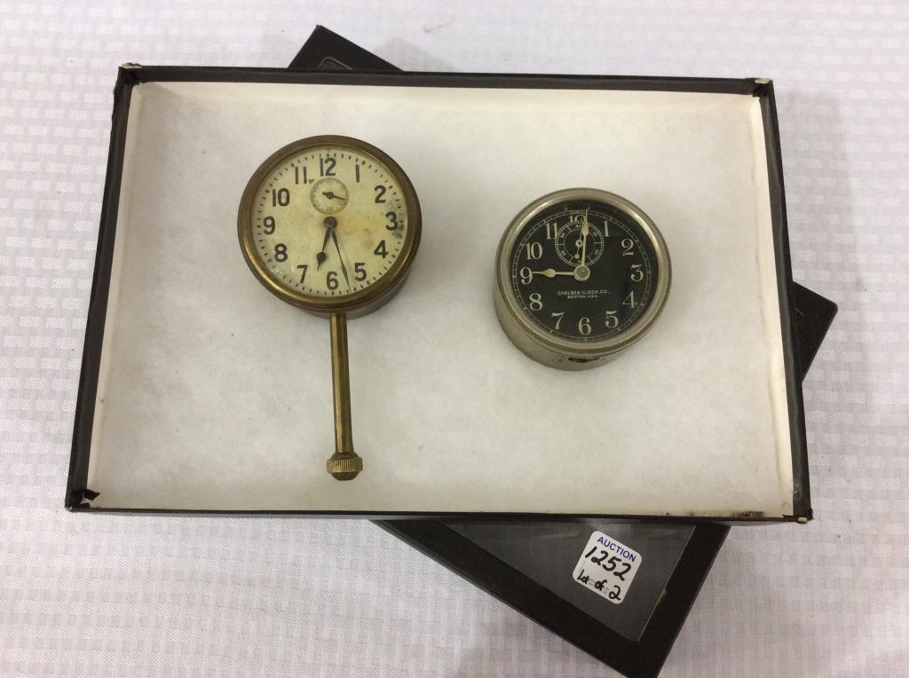 Lot of 2 Car Clocks Including One Marked