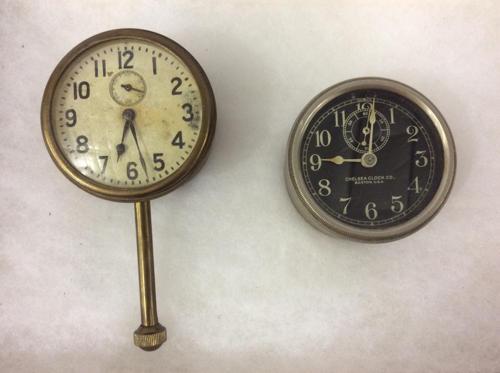Lot of 2 Car Clocks Including One Marked