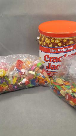 Cracker jack tin with 2 bags of charms