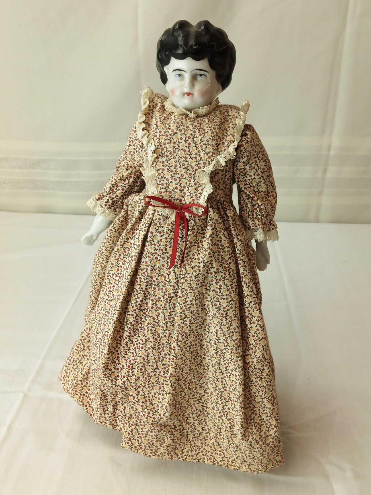 PORCELAIN JOINTED VINTAGE DOLL WITH METAL DOLL STAND 12"