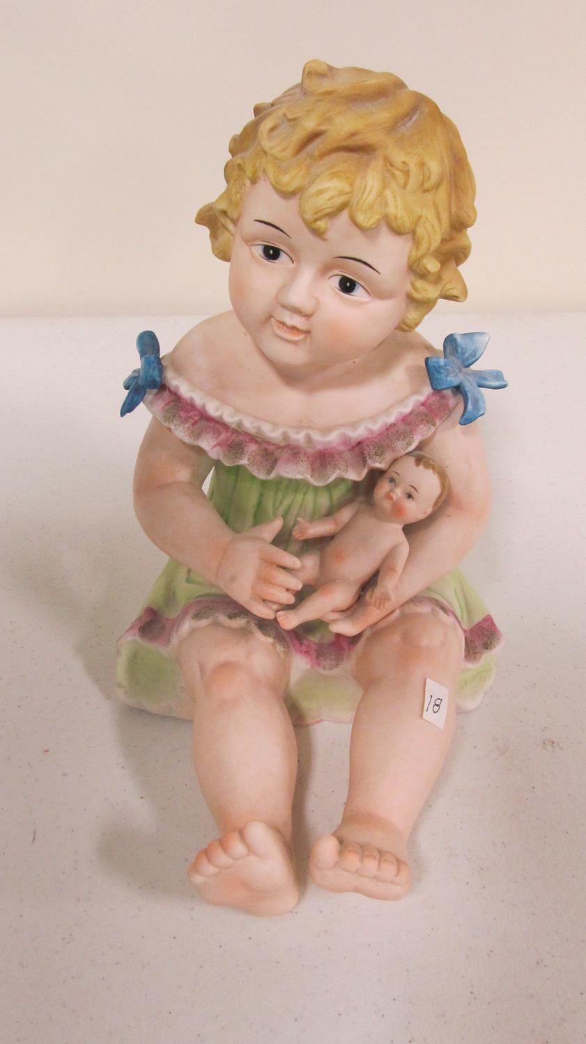 Bisque piano baby - girl holding baby