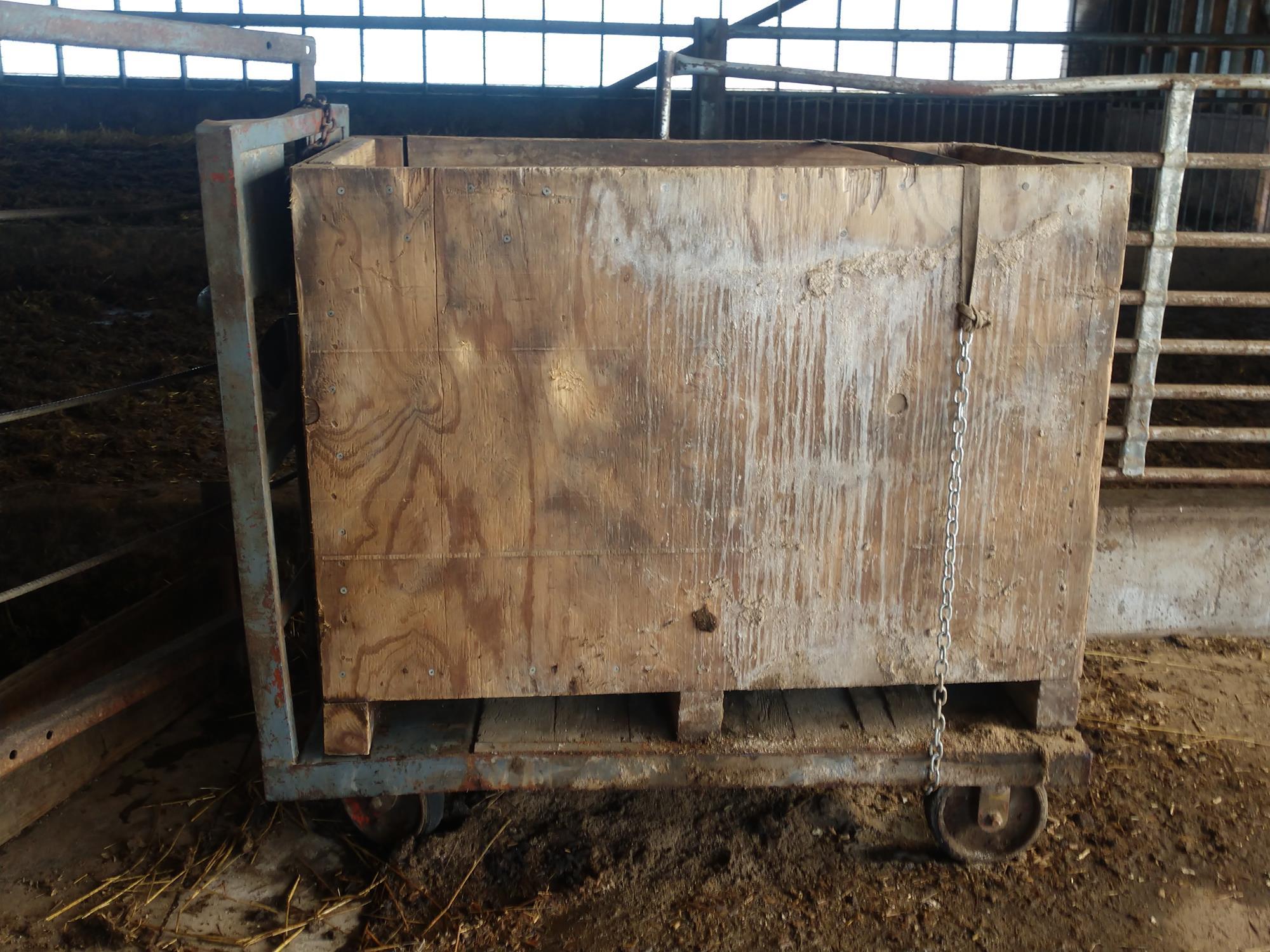 Open shed contents (scrap iron, truck toolbox, old JCB diesel engine in cr