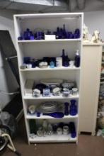 BOOKCASE, BLUE GLASS ITEMS, VARIOUS BLUE AND WHITE PLATTERS, CUPS AND DISHE