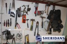 ASSORTED TOOLS HANGING ON PEGBOARD AS SHOWN IN PICTURE.